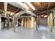 Exposed ceiling and ductwork in a partially finished basement space with concrete floor at 2044 Wilandrew Dr, Decatur, GA 30033