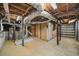 Unfinished basement with exposed pipes, a water heater, and room for future customization at 2044 Wilandrew Dr, Decatur, GA 30033
