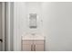 Powder room with sink and mirror in neutral tones at 2044 Wilandrew Dr, Decatur, GA 30033