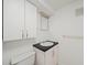 This bathroom offers a classic design with a toilet, vanity, sink, and storage at 2044 Wilandrew Dr, Decatur, GA 30033