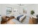 Bedroom featuring hardwood floors, ceiling fan, area rug and two windows at 2044 Wilandrew Dr, Decatur, GA 30033