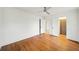 Bright bedroom features a ceiling fan, white walls and hardwood floors at 2044 Wilandrew Dr, Decatur, GA 30033
