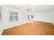 Bright living room featuring hardwood floors, built-in shelves, modern lighting, and large windows at 2044 Wilandrew Dr, Decatur, GA 30033