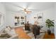 Bright office with hardwood floors, fan, and french doors to sun room at 2044 Wilandrew Dr, Decatur, GA 30033