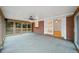 Sunroom featuring concrete floors, brick wall, and access to the outside at 2044 Wilandrew Dr, Decatur, GA 30033