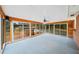 Enclosed sunroom with natural light, access to back deck, and brick wall at 2044 Wilandrew Dr, Decatur, GA 30033