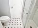 Clean bathroom featuring toilet and glass enclosed shower with tiled walls at 1244 Hickory Wood Ne Dr, Woodstock, GA 30188