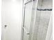 Bathroom features a glass shower enclosure with a door at 1244 Hickory Wood Ne Dr, Woodstock, GA 30188