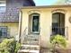 Inviting entrance showcasing stone steps leading to the glass front door at 1244 Hickory Wood Ne Dr, Woodstock, GA 30188