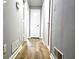 Hallway with modern wood flooring and neutral wall color, doors and trim at 1244 Hickory Wood Ne Dr, Woodstock, GA 30188