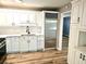 This modern kitchen features white cabinets and stainless steel appliances at 1244 Hickory Wood Ne Dr, Woodstock, GA 30188