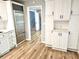 Beautiful kitchen features white cabinets, stainless steel appliances, and stylish countertops at 1244 Hickory Wood Ne Dr, Woodstock, GA 30188
