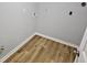 Utility area with hookups and modern flooring, ready for washer and dryer at 1244 Hickory Wood Ne Dr, Woodstock, GA 30188