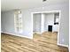 Spacious living room boasts new floors, light gray walls, and bright natural light at 1244 Hickory Wood Ne Dr, Woodstock, GA 30188