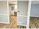 Inviting living space showcases views into the updated kitchen with stainless steel appliances at 1244 Hickory Wood Ne Dr, Woodstock, GA 30188