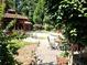 Inviting backyard with a private pool, gazebo, outdoor seating, and lush landscaping, perfect for entertaining at 1244 Hickory Wood Ne Dr, Woodstock, GA 30188