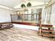 Bright sun room with new flooring and a tiered design at 1244 Hickory Wood Ne Dr, Woodstock, GA 30188