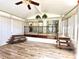 Bright sun room with new flooring and a tiered design at 1244 Hickory Wood Ne Dr, Woodstock, GA 30188