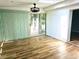 Bright sun room with new flooring and a sliding glass door at 1244 Hickory Wood Ne Dr, Woodstock, GA 30188