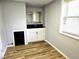 Stylish wet bar area featuring modern cabinets and a sleek countertop at 1244 Hickory Wood Ne Dr, Woodstock, GA 30188