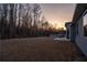 Expansive backyard featuring a patio perfect for entertaining and relaxing at sunset at 15 Parkside Vw, Cartersville, GA 30121