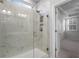 Bathroom featuring a marble-tiled shower with glass door next to the main bedroom at 15 Parkside Vw, Cartersville, GA 30121