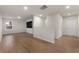 Second bonus room featuring hardwood floors, a large tv screen and access to another room at 15 Parkside Vw, Cartersville, GA 30121