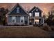 Charming two-story home with inviting front porch and well-maintained lawn under a stunning sunset at 15 Parkside Vw, Cartersville, GA 30121