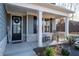 Charming front porch featuring rocking chairs and a welcoming entrance with a wreath on the door at 15 Parkside Vw, Cartersville, GA 30121