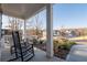 Relaxing front porch with rocking chairs and a view of the well-maintained neighborhood at 15 Parkside Vw, Cartersville, GA 30121