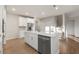 Bright kitchen includes stainless steel appliances, white cabinets, and a large island for ample counter space at 15 Parkside Vw, Cartersville, GA 30121