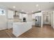 Bright, open-concept kitchen features an island, stainless steel appliances, and an elegant backsplash at 15 Parkside Vw, Cartersville, GA 30121