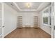 Office showcasing natural light, wood floors, tray ceiling, and decorative chandelier at 15 Parkside Vw, Cartersville, GA 30121