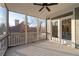 Relaxing screened-in porch with serene views, ceiling fan, and access to the outside at 15 Parkside Vw, Cartersville, GA 30121
