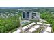 Aerial view of townhomes in a vibrant community setting near commercial buildings at 1598 Aldworth Se Pl, Marietta, GA 30067