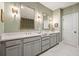 Well lit bathroom with double vanities and modern fixtures at 1598 Aldworth Se Pl, Marietta, GA 30067