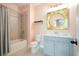 Charming bathroom with a tub-shower combo and light blue vanity at 1598 Aldworth Se Pl, Marietta, GA 30067