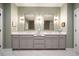 Elegant bathroom featuring a double sink vanity with modern fixtures and marble countertops at 1598 Aldworth Se Pl, Marietta, GA 30067