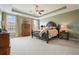 Large bedroom with tray ceilings, neutral carpet, and ample natural light at 1598 Aldworth Se Pl, Marietta, GA 30067
