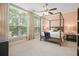 Light-filled bedroom with a four-poster bed and large windows at 1598 Aldworth Se Pl, Marietta, GA 30067