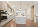 Spacious kitchen with stainless steel appliances, a large island, and hardwood floors at 1598 Aldworth Se Pl, Marietta, GA 30067