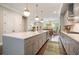 Open concept kitchen with a quartz island, pendant lighting, and modern cabinetry at 1598 Aldworth Se Pl, Marietta, GA 30067