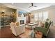 Cozy living room with a fireplace, comfortable seating, and natural light at 1598 Aldworth Se Pl, Marietta, GA 30067