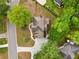 Aerial view showcasing a home situated in a beautifully landscaped yard with mature trees at 1770 Laurel Creek Dr, Lawrenceville, GA 30043