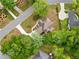 Aerial shot showcasing a well-maintained home nestled in a lush neighborhood with mature trees at 1770 Laurel Creek Dr, Lawrenceville, GA 30043