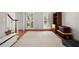 Versatile room near the entry with hardwood floors, storage furniture, and large windows at 1770 Laurel Creek Dr, Lawrenceville, GA 30043