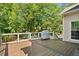Inviting wooden deck perfect for outdoor dining and entertaining with privacy at 1770 Laurel Creek Dr, Lawrenceville, GA 30043