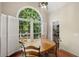 Cozy dining area with charming windows, natural light, and a wooden table set for meals at 1770 Laurel Creek Dr, Lawrenceville, GA 30043