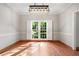 Formal dining area featuring a modern chandelier and bright windows offering scenic outdoor views at 1770 Laurel Creek Dr, Lawrenceville, GA 30043