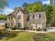 Beautiful home featuring manicured landscaping, a charming facade, and an attached garage for convenient parking at 1770 Laurel Creek Dr, Lawrenceville, GA 30043